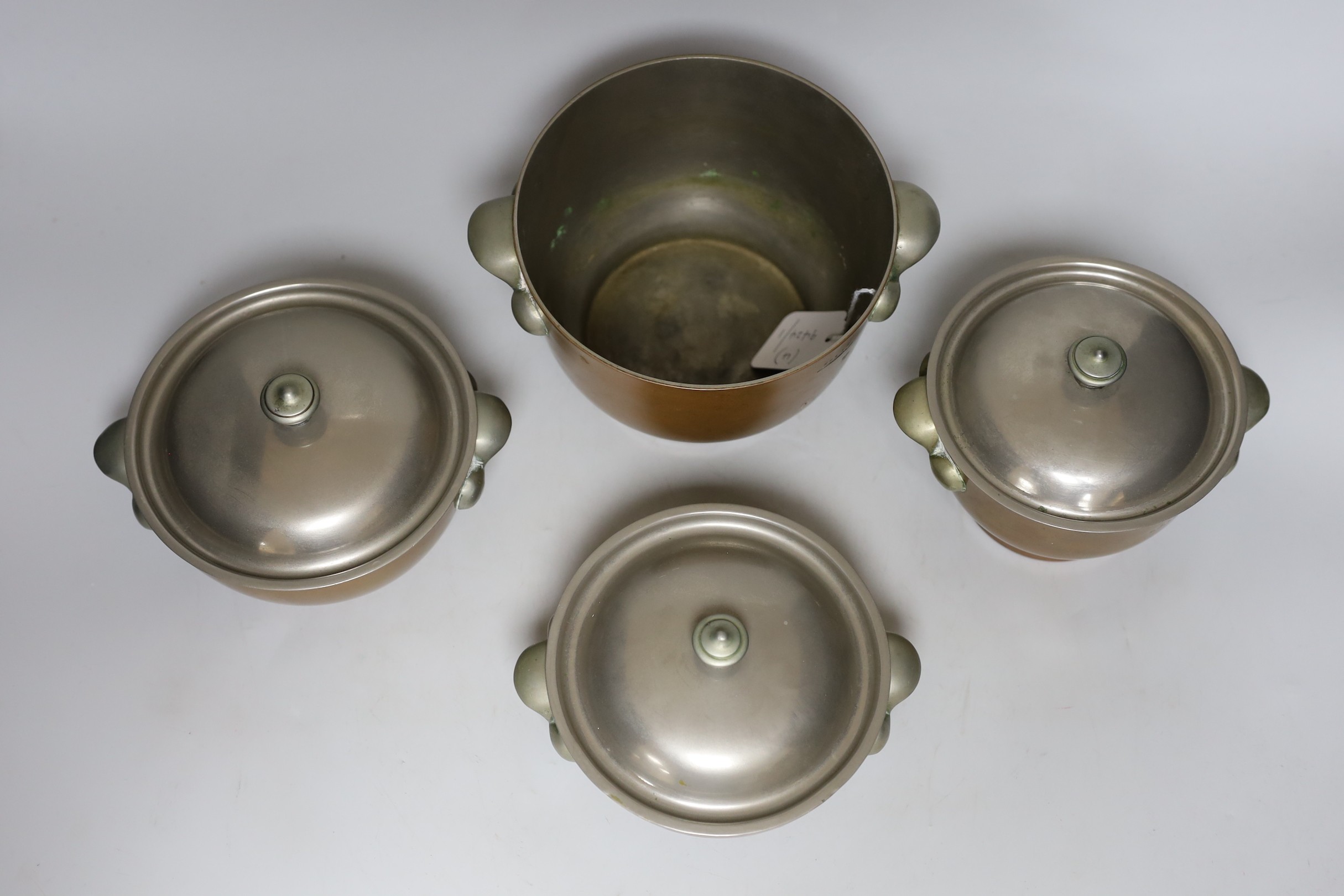 Four graduated Elkington & Co. copper bowls, three with covers, tallest 12cm